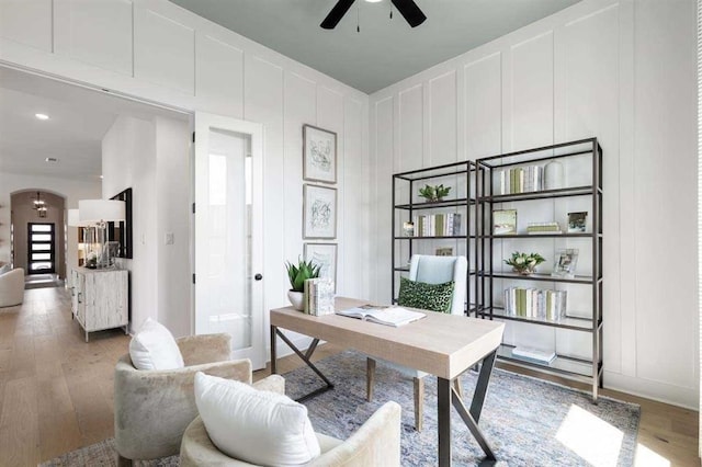 office area with ceiling fan and light wood-type flooring