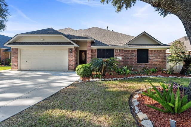 ranch-style house with a garage and a front lawn