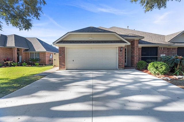 view of front facade featuring a garage and a front lawn