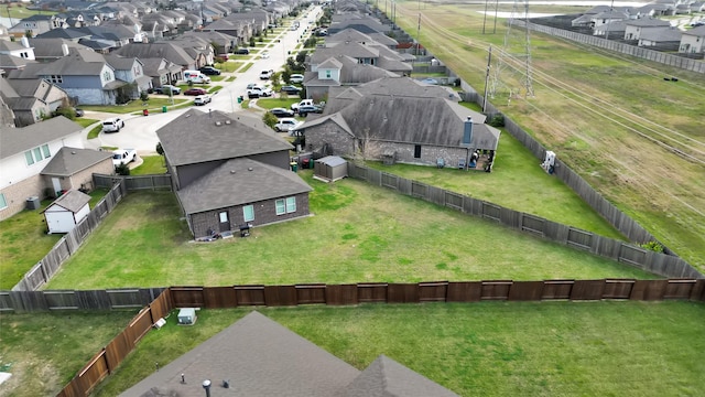 birds eye view of property with a residential view