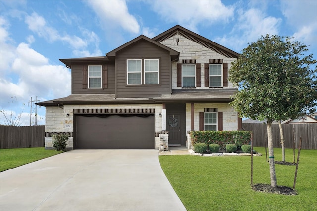 view of front facade with a garage, fence, stone siding, concrete driveway, and a front lawn