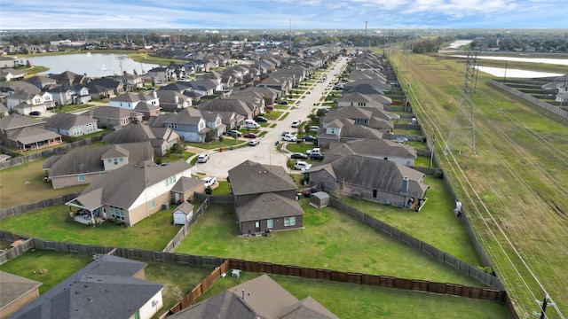 aerial view with a water view and a residential view