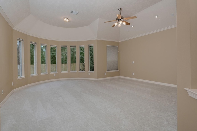 unfurnished room featuring visible vents, light carpet, a ceiling fan, crown molding, and baseboards