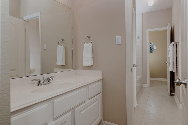 bathroom with tile patterned flooring, vanity, shower / bathtub combination, and baseboards