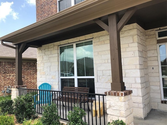 entrance to property featuring a porch