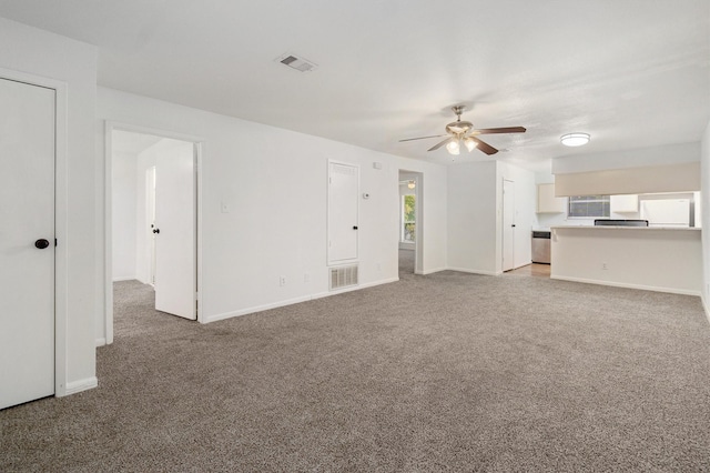 unfurnished living room featuring light carpet and ceiling fan