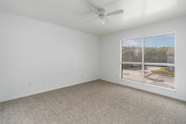 empty room with carpet and ceiling fan