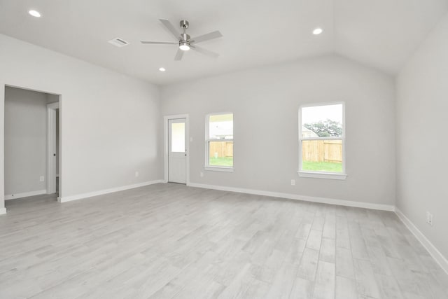 empty room featuring light wood-type flooring, ceiling fan, and lofted ceiling