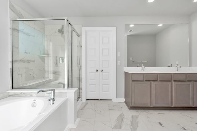 bathroom featuring separate shower and tub and vanity