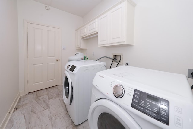 laundry room featuring cabinets and independent washer and dryer