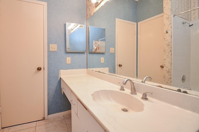 bathroom featuring tile patterned flooring and vanity