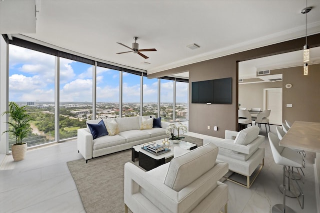 living room with floor to ceiling windows, plenty of natural light, and ceiling fan