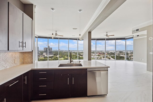 kitchen with a wealth of natural light, dishwasher, expansive windows, and sink