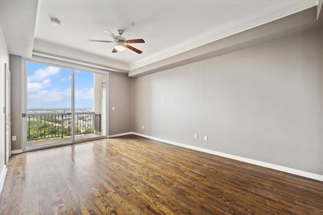 unfurnished room featuring hardwood / wood-style flooring, ceiling fan, and ornamental molding