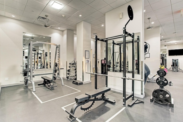 gym featuring a drop ceiling