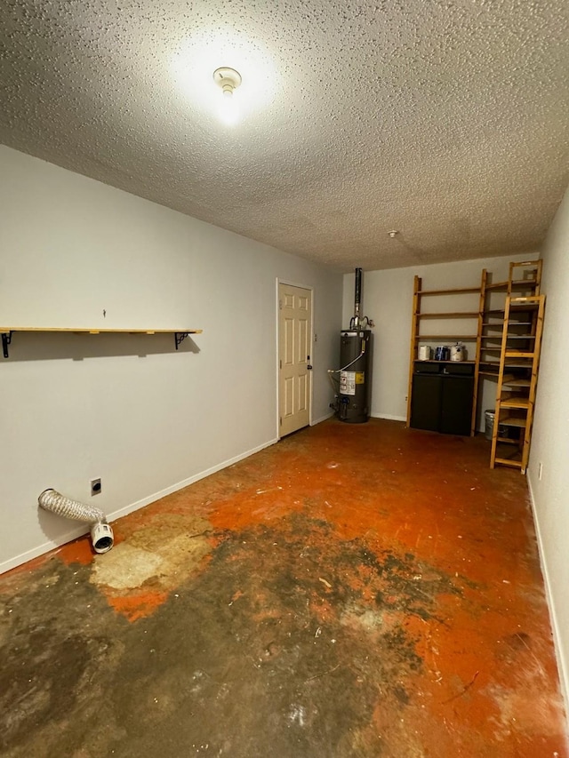 basement featuring gas water heater and a textured ceiling