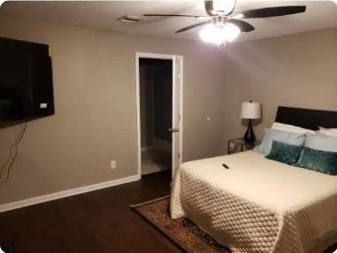 bedroom with ceiling fan and dark hardwood / wood-style flooring