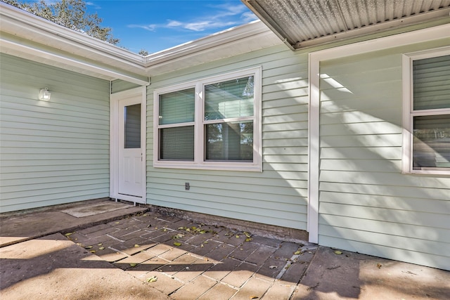 property entrance with a patio