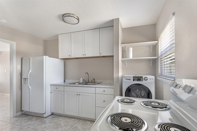 kitchen with white cabinetry, sink, washer / clothes dryer, and white refrigerator with ice dispenser