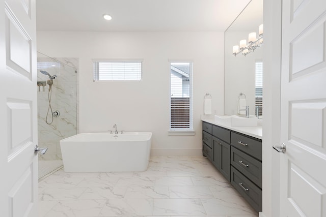 bathroom with vanity and separate shower and tub