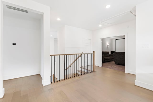 hall with light hardwood / wood-style floors