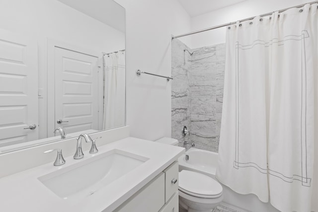 full bathroom featuring shower / tub combo with curtain, vanity, and toilet