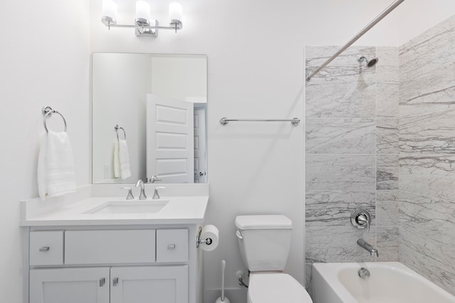 full bathroom with vanity, toilet, and tiled shower / bath