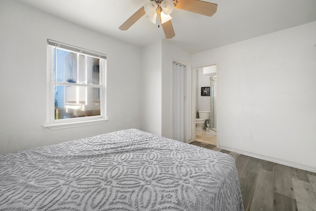 bedroom with ceiling fan, hardwood / wood-style floors, and ensuite bathroom