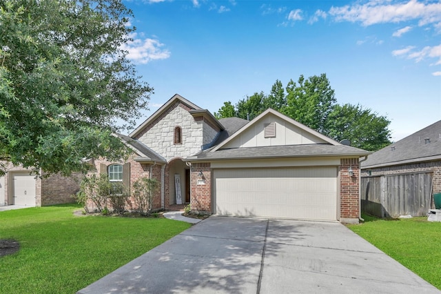 view of front of home featuring a front lawn and a garage