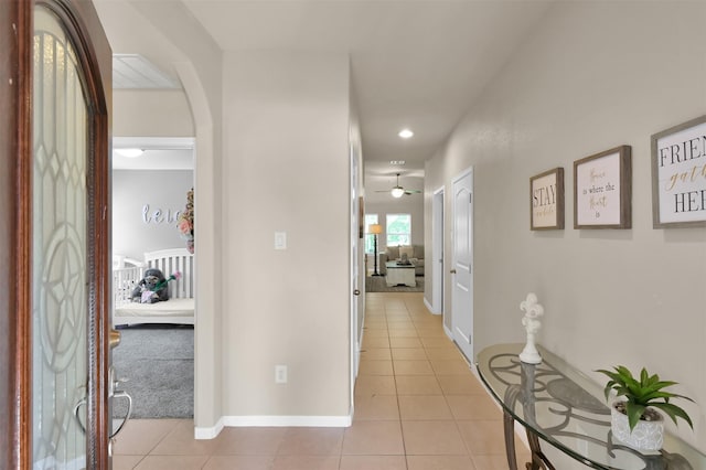 hall with light tile patterned flooring