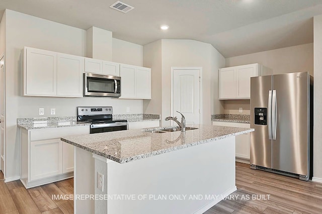 kitchen featuring white cabinetry, appliances with stainless steel finishes, and light hardwood / wood-style flooring