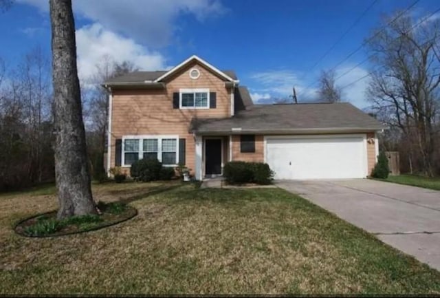 front facade with a front yard and a garage