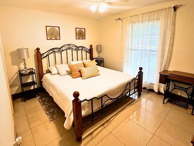 bedroom with light tile patterned floors and ceiling fan