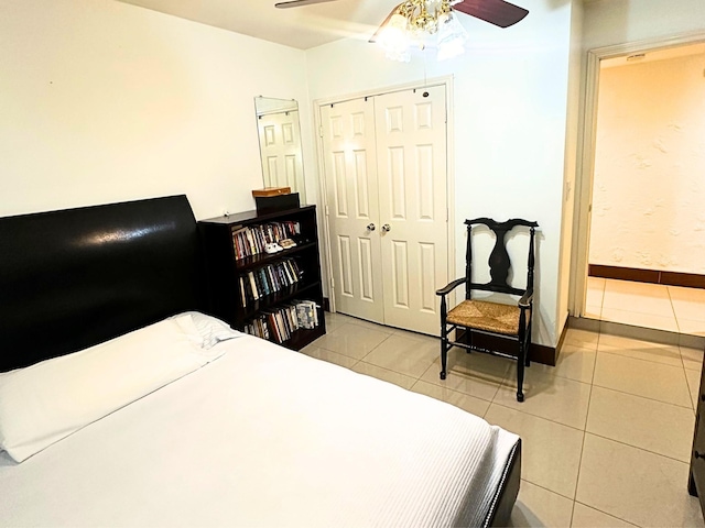 tiled bedroom with ceiling fan