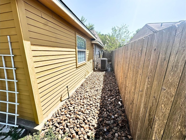 view of home's exterior with central AC unit