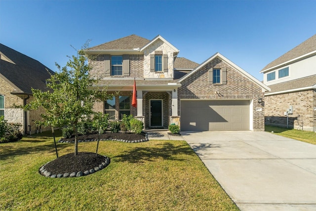 view of front of home featuring a garage and a front lawn