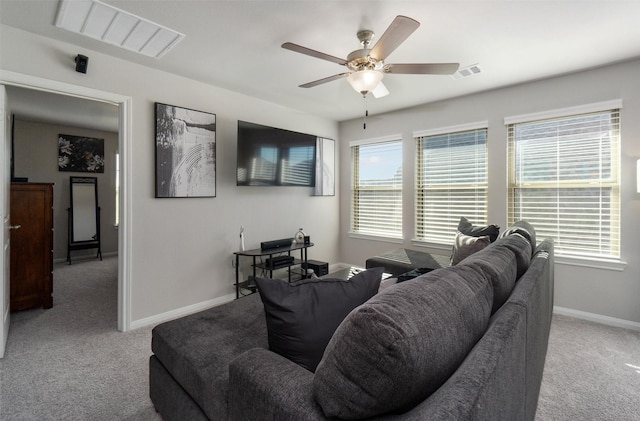 carpeted living room featuring ceiling fan