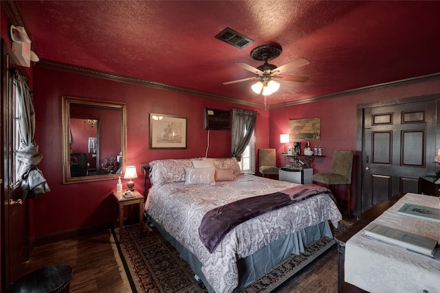 bedroom featuring ceiling fan, dark hardwood / wood-style floors, ornamental molding, and a textured ceiling