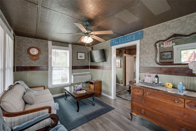 living room with ceiling fan and light hardwood / wood-style floors