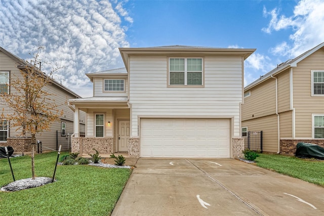 view of property with a front yard and a garage