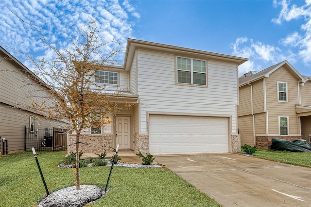 front of property with a garage and a front lawn