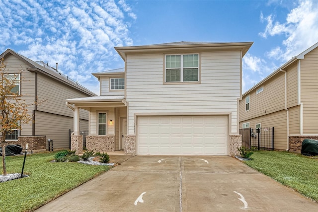 view of front property featuring a garage and a front lawn