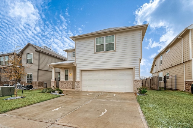 front of property featuring a garage and a front lawn