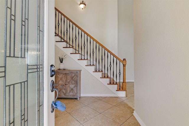 entrance foyer with light tile patterned floors