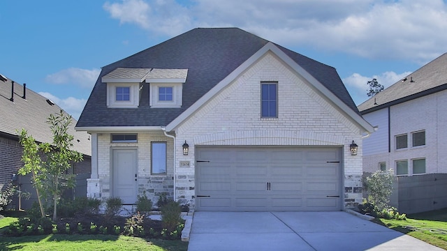 view of front of property with a garage