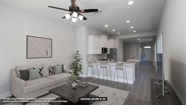 living room featuring ceiling fan