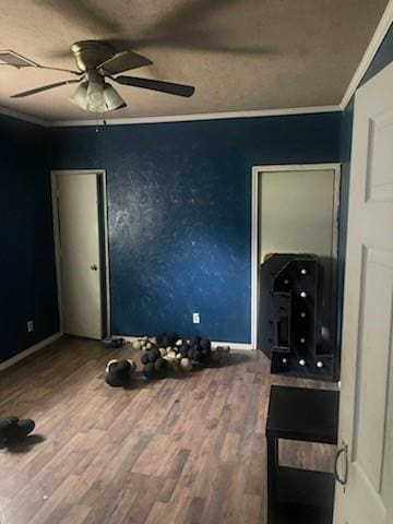 bedroom with ceiling fan, wood-type flooring, and ornamental molding