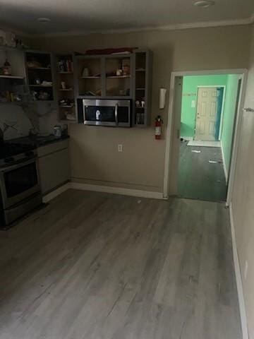 kitchen with electric stove and wood-type flooring