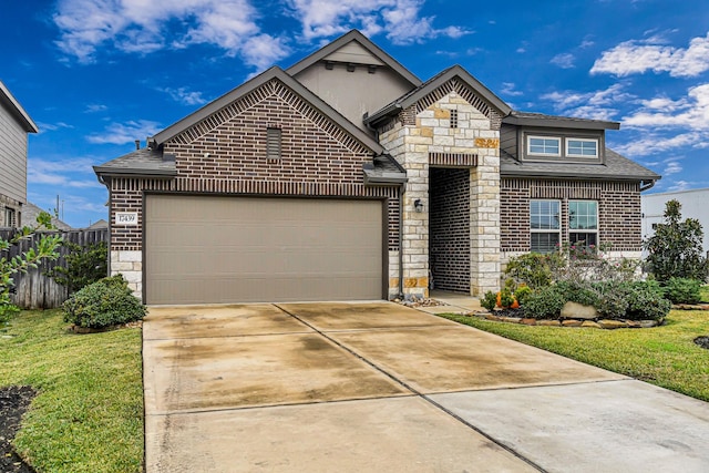 view of front of house featuring a front yard and a garage