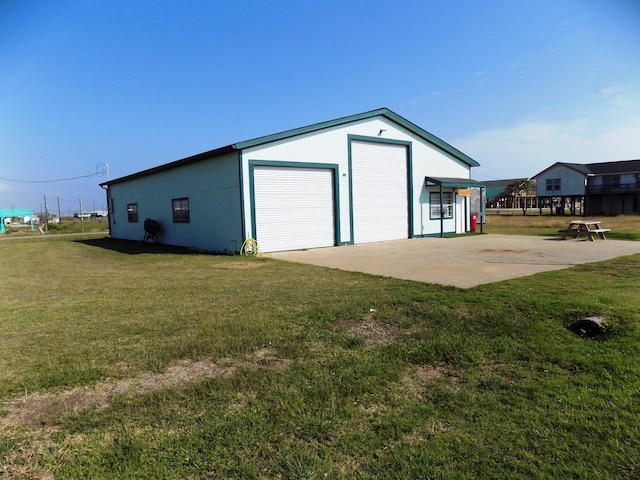 garage featuring a yard